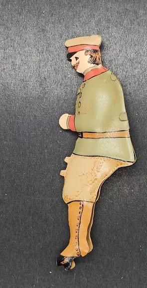 Early tinplate toy driver handpainted.